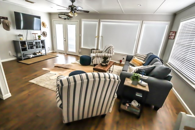 living room with visible vents, baseboards, french doors, wood finished floors, and a ceiling fan