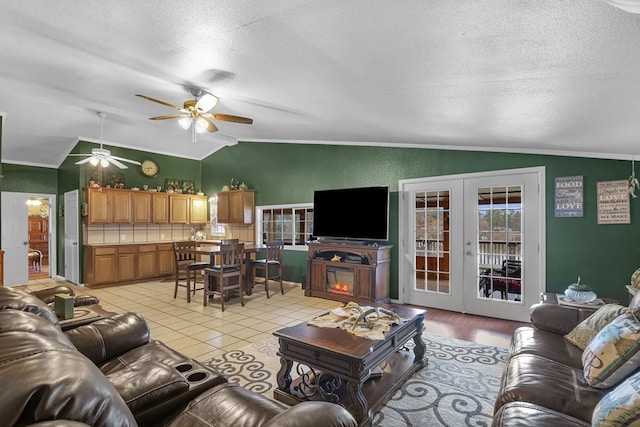 tiled living room with french doors, ceiling fan, lofted ceiling, and a textured ceiling