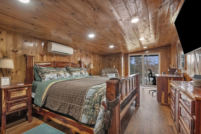 bedroom featuring hardwood / wood-style floors, wooden walls, access to outside, wood ceiling, and a wall unit AC