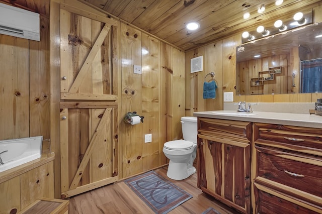 bathroom featuring wood ceiling, hardwood / wood-style flooring, vanity, an AC wall unit, and toilet