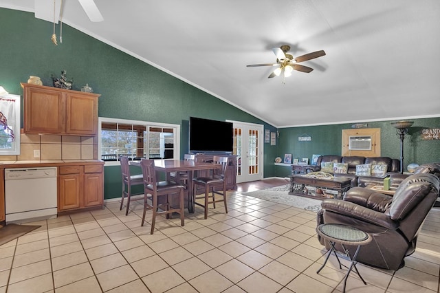 tiled living room with ceiling fan, ornamental molding, and vaulted ceiling