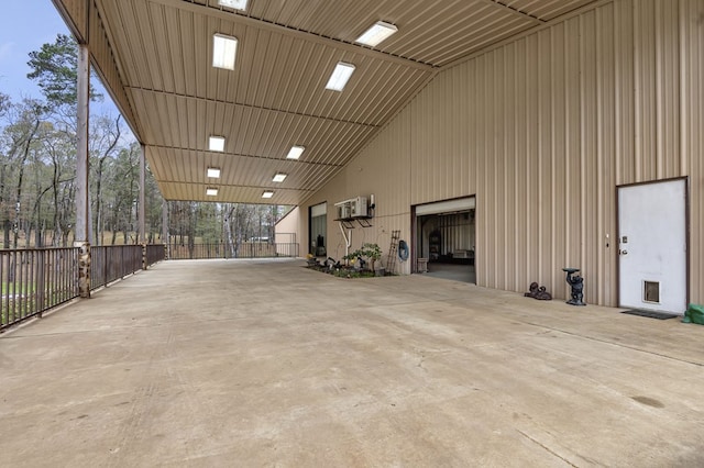 garage featuring a wall mounted air conditioner