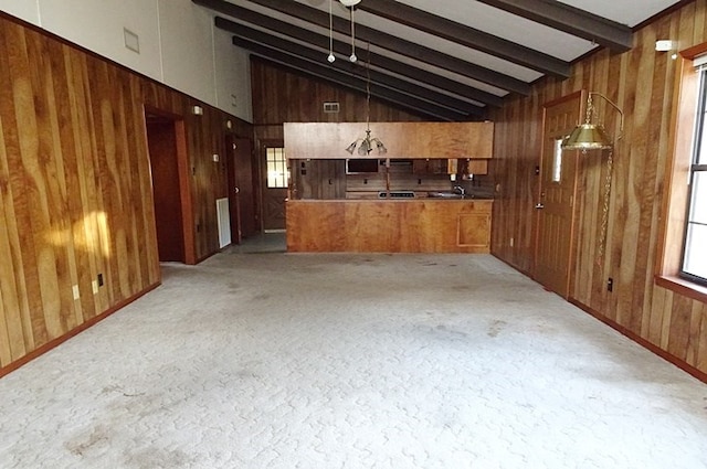 bar with vaulted ceiling with beams, hanging light fixtures, and wood walls