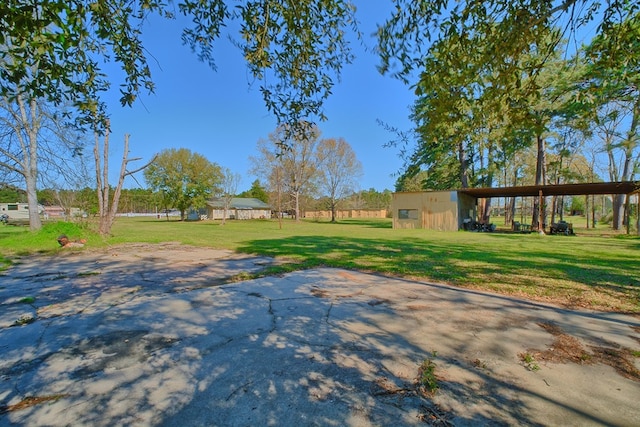 view of yard with an outbuilding and an outdoor structure