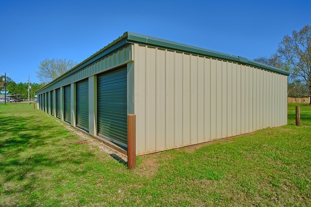 view of pole building with a yard