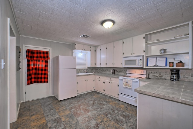 kitchen featuring visible vents, white cabinets, white appliances, and open shelves