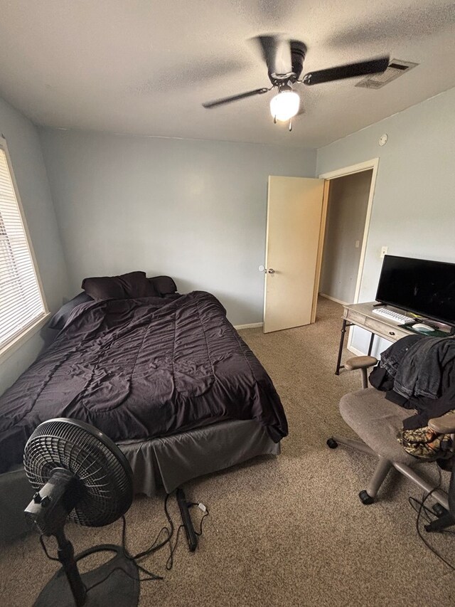 11774 US Highway 69 S, Huntington, TX 75949 - carpeted bedroom with a ceiling fan and a textured ceiling