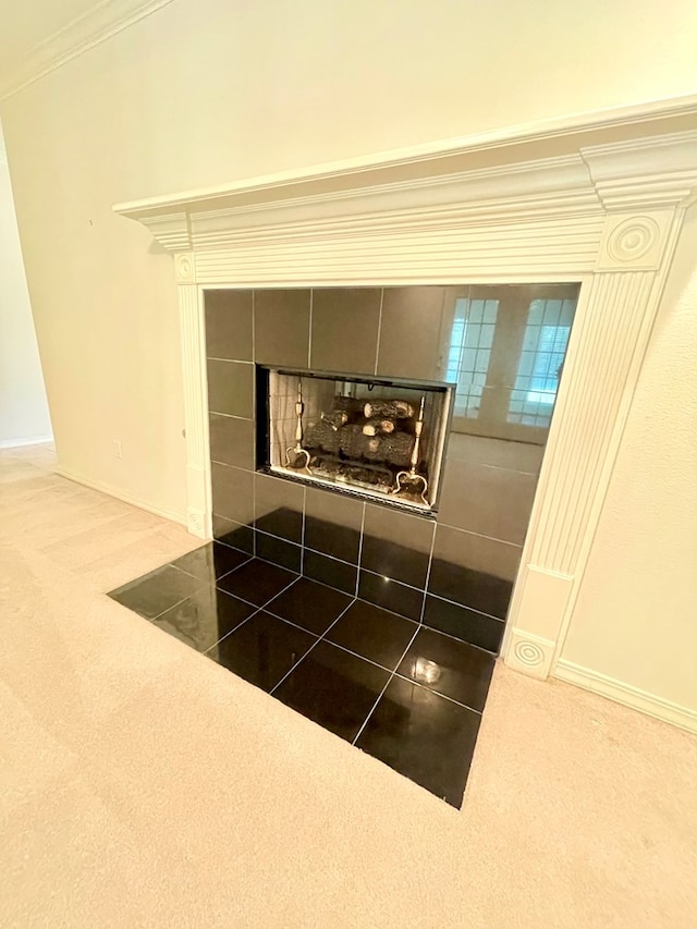 details with carpet floors and a tile fireplace