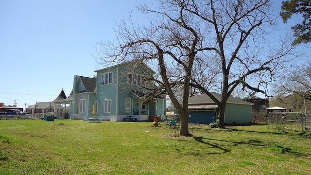 110 Market St, Hemphill, TX 75948 - rear view of property with a yard and fence