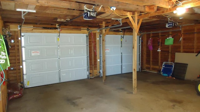 110 Market St, Hemphill, TX 75948 - garage featuring a garage door opener