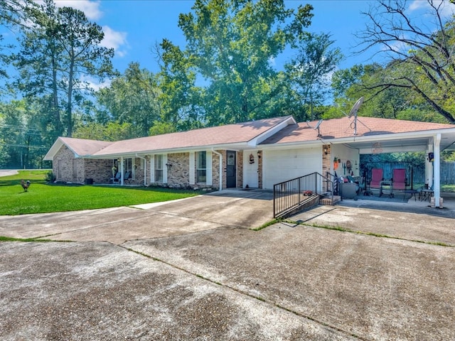 ranch-style home featuring a garage and a front yard