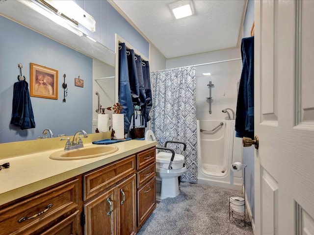 bathroom featuring vanity, curtained shower, toilet, and a textured ceiling