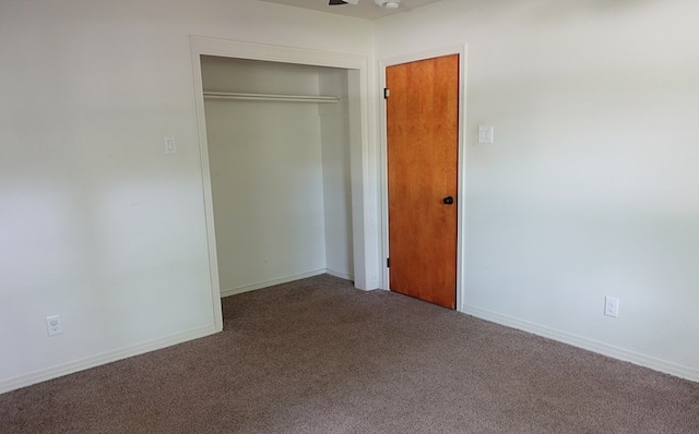 1009 Mockingbird Ln, Nacogdoches, TX 75964 - unfurnished bedroom featuring carpet flooring and a closet