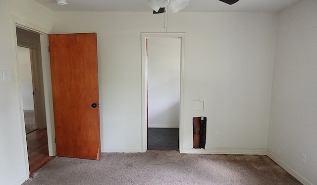 1009 Mockingbird Ln, Nacogdoches, TX 75964 - unfurnished bedroom featuring carpet and a ceiling fan