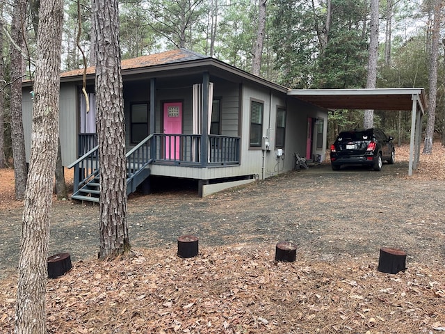 view of front of property featuring a carport