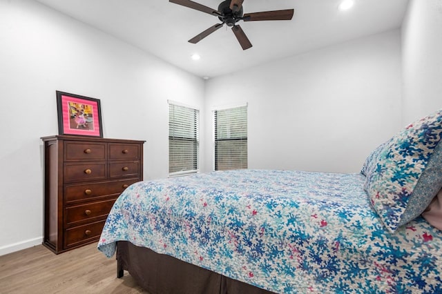 bedroom with a ceiling fan, recessed lighting, light wood-style flooring, and baseboards