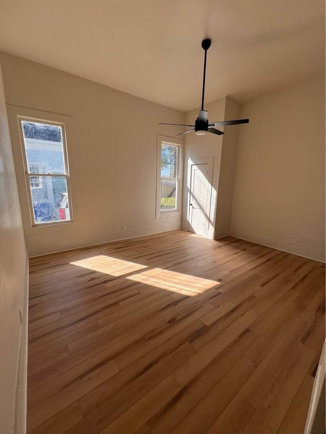 spare room featuring light wood-style flooring and ceiling fan