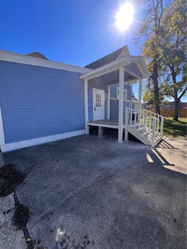 view of exterior entry with fence