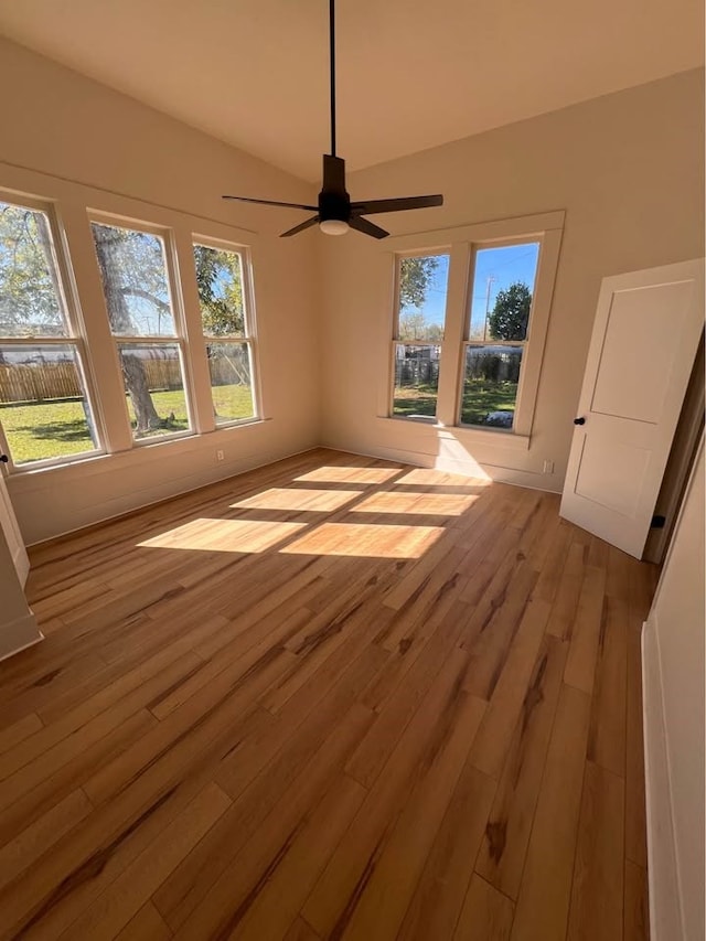 interior space with light wood-type flooring, ceiling fan, and baseboards