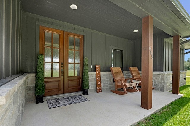 685 Box Car Rd, Lufkin, TX 75904 - view of exterior entry featuring french doors and board and batten siding