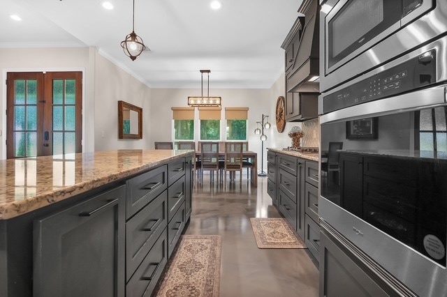 685 Box Car Rd, Lufkin, TX 75904 - kitchen featuring stainless steel appliances, crown molding, recessed lighting, light stone countertops, and decorative light fixtures