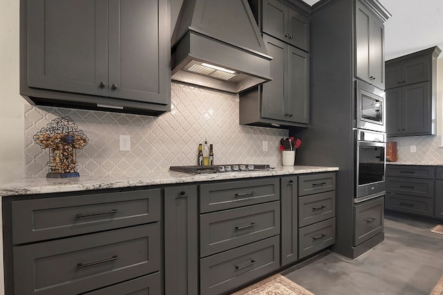 685 Box Car Rd, Lufkin, TX 75904 - kitchen featuring appliances with stainless steel finishes, custom exhaust hood, tasteful backsplash, and gray cabinets