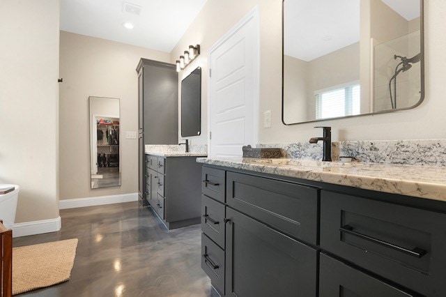 685 Box Car Rd, Lufkin, TX 75904 - full bathroom featuring baseboards, vanity, finished concrete floors, and toilet