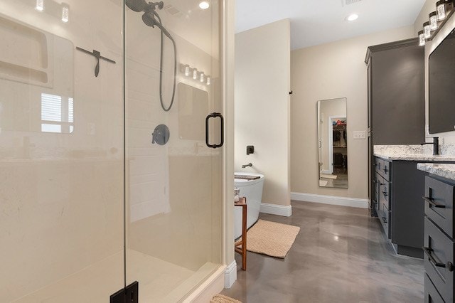 685 Box Car Rd, Lufkin, TX 75904 - bathroom featuring a stall shower, vanity, baseboards, concrete floors, and recessed lighting
