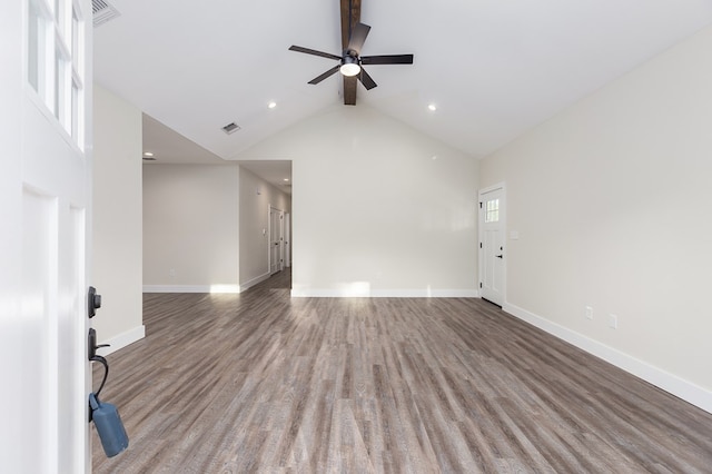 spare room with hardwood / wood-style floors, high vaulted ceiling, ceiling fan, and a healthy amount of sunlight