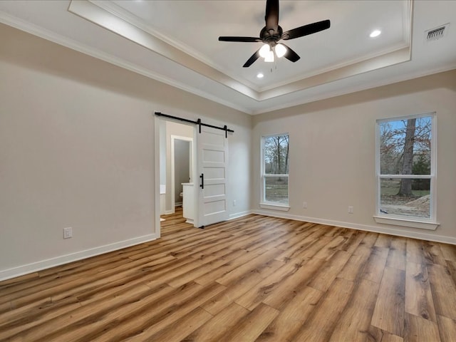 282 Lancewood Dr, Lufkin, TX 75904 - unfurnished bedroom with ornamental molding, multiple windows, visible vents, and a raised ceiling