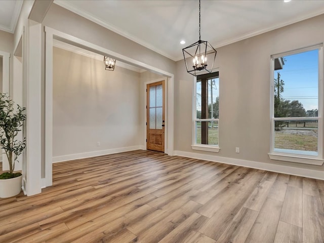 282 Lancewood Dr, Lufkin, TX 75904 - unfurnished dining area with an inviting chandelier, crown molding, and wood finished floors