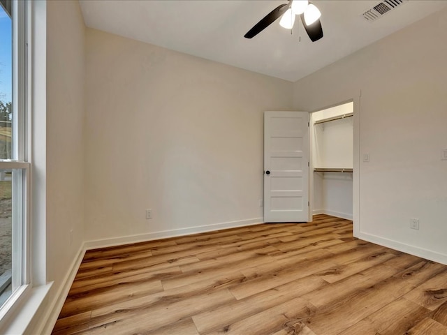 282 Lancewood Dr, Lufkin, TX 75904 - unfurnished bedroom featuring light wood-style flooring, baseboards, visible vents, a ceiling fan, and a closet