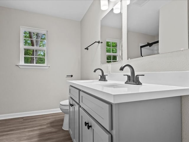 3202 Chimney Rock Ln, Nacogdoches, TX 75965 - bathroom featuring double vanity and wood finished floors