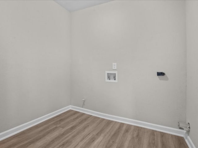 3202 Chimney Rock Ln, Nacogdoches, TX 75965 - laundry room featuring hookup for a washing machine, light wood-style flooring, and hookup for a gas dryer