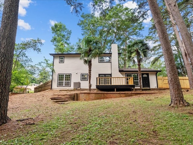 3202 Chimney Rock Ln, Nacogdoches, TX 75965 - back of house featuring a wooden deck and a chimney