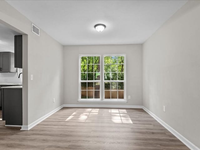 3202 Chimney Rock Ln, Nacogdoches, TX 75965 - unfurnished dining area with wood finished floors and baseboards