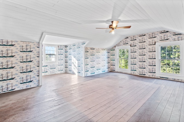 additional living space with ceiling fan, wood ceiling, lofted ceiling, and hardwood / wood-style flooring