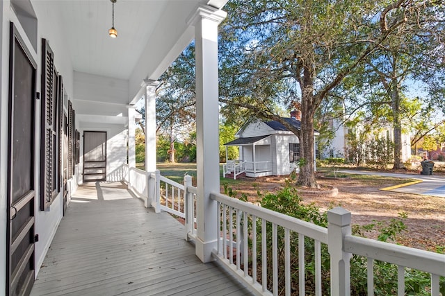 wooden terrace featuring a porch