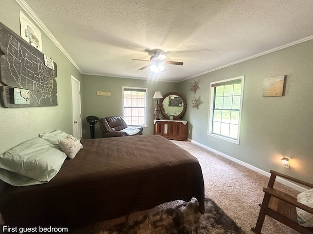 785 County Road 105, San Augustine, TX 75972 - carpeted bedroom with baseboards, ornamental molding, a ceiling fan, and a textured ceiling