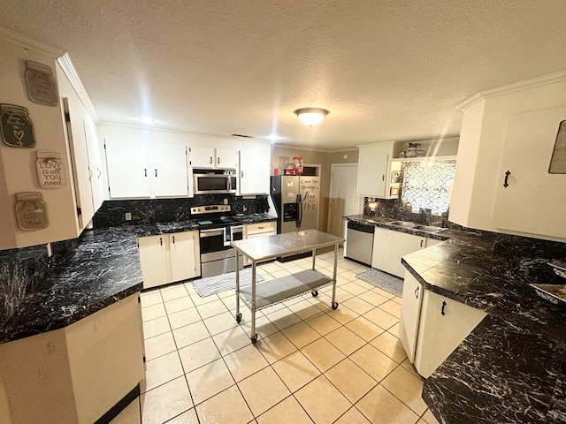 785 County Road 105, San Augustine, TX 75972 - kitchen featuring ornamental molding, decorative backsplash, a textured ceiling, light tile patterned floors, and stainless steel appliances