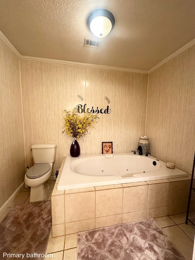 785 County Road 105, San Augustine, TX 75972 - bathroom with tile patterned flooring, toilet, a textured ceiling, a tub with jets, and visible vents