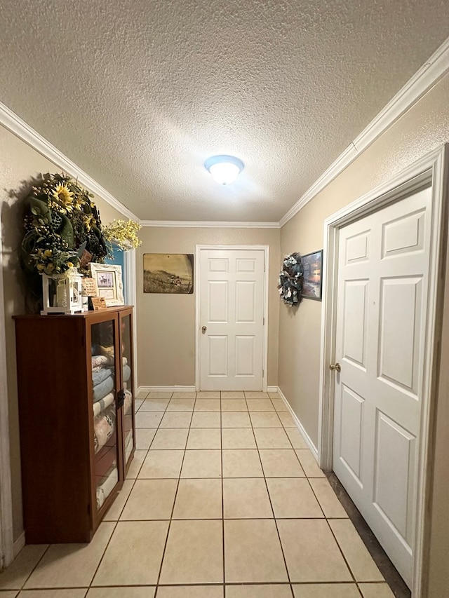 785 County Road 105, San Augustine, TX 75972 - interior space featuring crown molding, a textured ceiling, baseboards, and light tile patterned floors