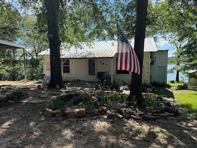 view of front of house featuring metal roof