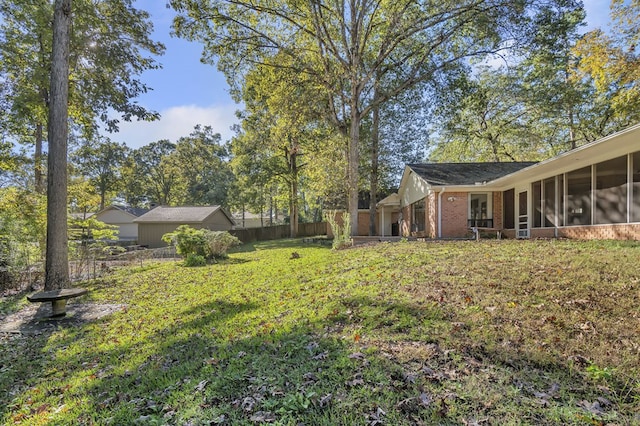 view of yard featuring a sunroom