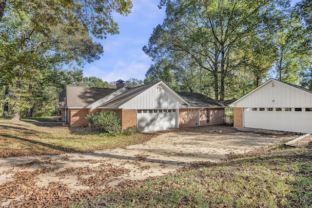 view of side of property featuring a yard and a garage