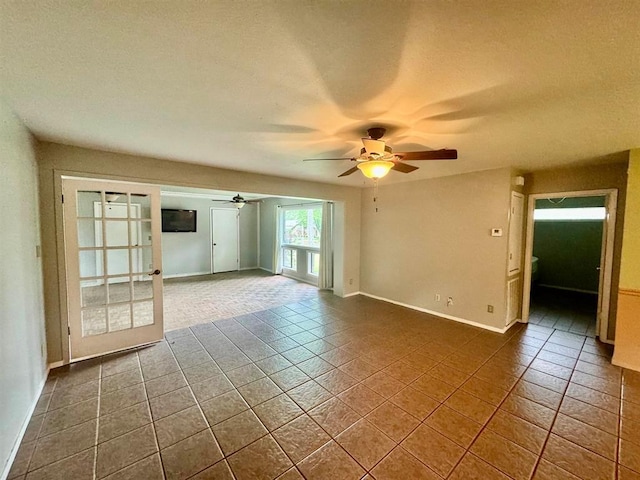 tiled empty room with ceiling fan