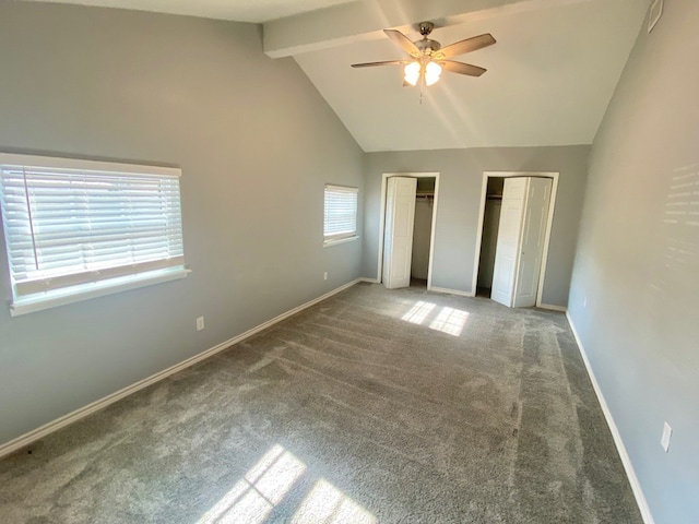 unfurnished bedroom with multiple windows, beam ceiling, carpet flooring, and ceiling fan