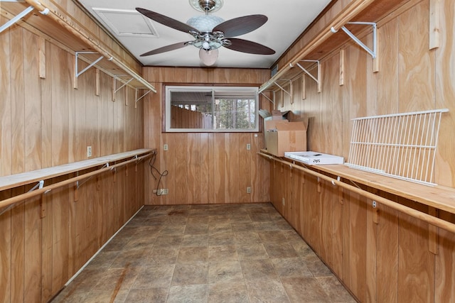 walk in closet with ceiling fan