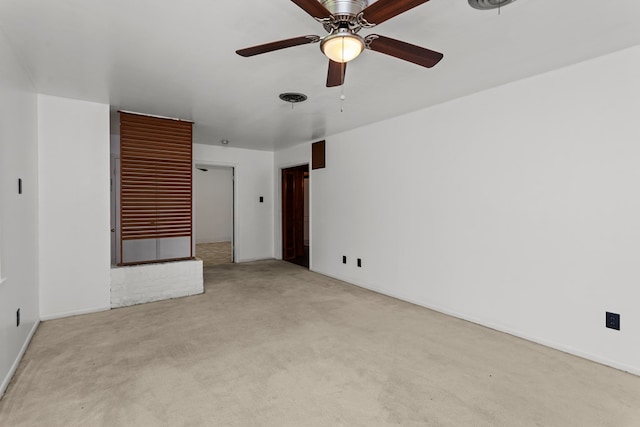 unfurnished room featuring ceiling fan and light colored carpet