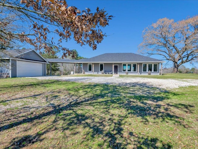 single story home featuring a front yard, covered porch, and driveway